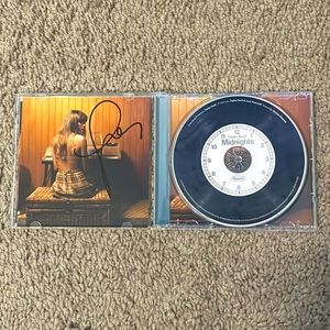 Midnights album signed by Taylor swift